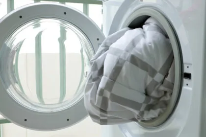 Washing,Machine,Loaded,With,Blanket.